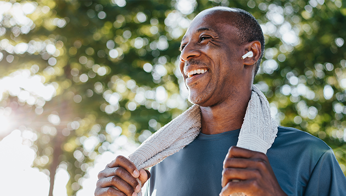 Man working out with a towel around his neck Man working out with a towel around his neck